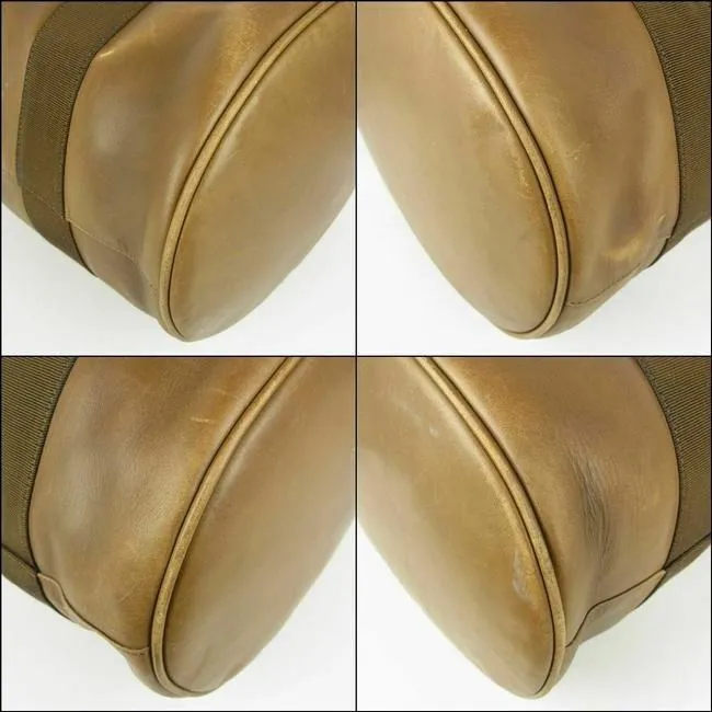 Amazing, Salvatore Ferragamo, RARE, olive green leather XL bucket bag or backpack with a gold Vara accent and a drawstring top closure
